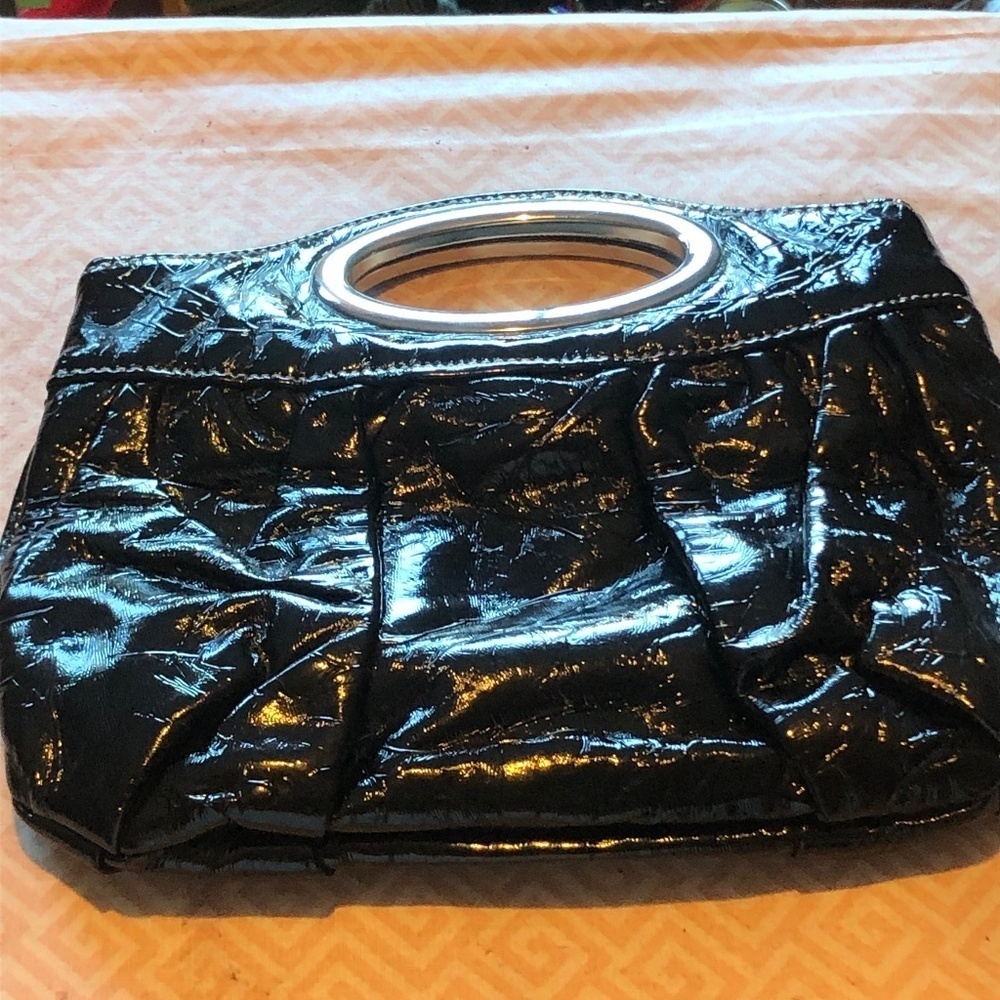 Nice looking clutch with metal handle and snap inside,  real clean, like new